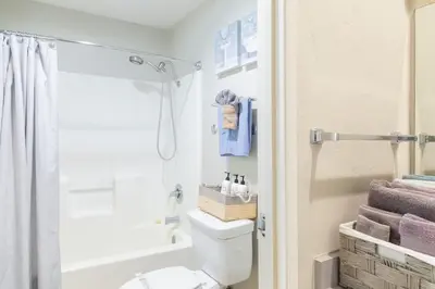 a bathroom with a toilet and a shower at Top Floor Walk to Conv Center Free Parking in San Diego