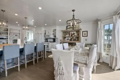 a kitchen with a table and chairs and a dining room at Luxury Ocean Views & Steps To The Sand - Tower 36 Lower Condo Unit in Carlsbad