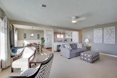 a living room with a couch and a table at Oceanfront Escape Steps to Imperial Beach! in Imperial Beach