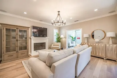 a living room with a couch and a fireplace at @ Marbella Lane - Modern and Sophisticated Home in Irvine