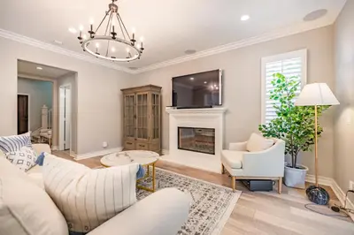 a living room with a couch and a fireplace at @ Marbella Lane - Modern and Sophisticated Home in Irvine
