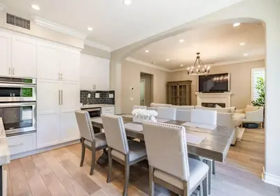 a kitchen and dining room with a table and chairs at @ Marbella Lane - Modern and Sophisticated Home in Irvine