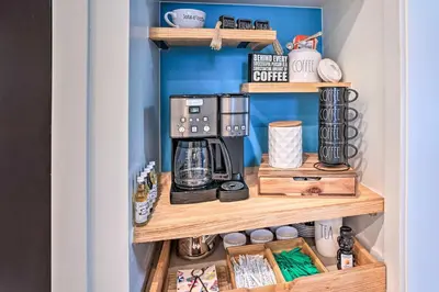 a cupboard with a coffee maker on a shelf at Luxe Laguna Home with Ocean View Walk to Beach in Laguna Beach