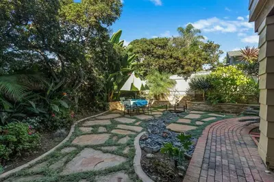a garden with a brick walkway and a patio at Oceanview, Walk To Beach, Fire Pit in Carlsbad
