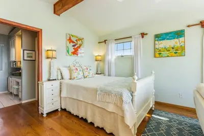 a bedroom with a white bed and a window at Oceanview, Walk To Beach, Fire Pit in Carlsbad