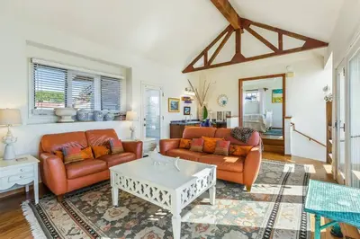 a living room with two couches and a table at Oceanview, Walk To Beach, Fire Pit in Carlsbad