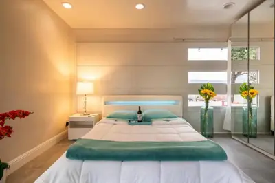a large bedroom with a large bed and a window at MAGIC VILLA Overlooking Pool Oasis in Temecula