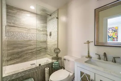 a bathroom with a toilet and a sink and a shower at MAGIC VILLA Overlooking Pool Oasis in Temecula