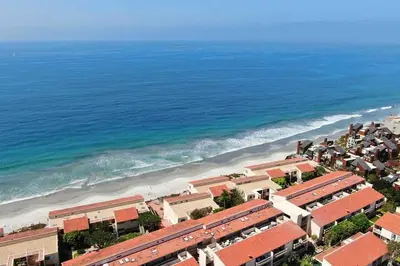 an aerial view of a beach with buildings and the ocean at Oceanfront Views, Heated Pool, Hot Tubs, Parking in Solana Beach