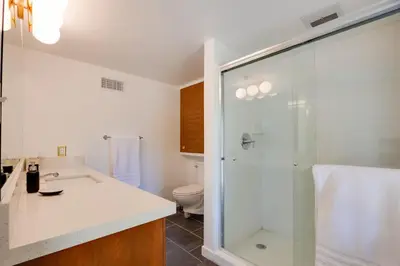 a bathroom with a shower and a sink and a toilet at Borrego Springs Retreat with Pool and Mtn Views in Borrego Springs