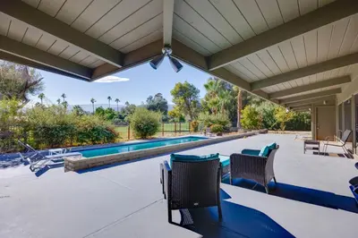 a patio with chairs and a swimming pool at Borrego Springs Retreat with Pool and Mtn Views in Borrego Springs