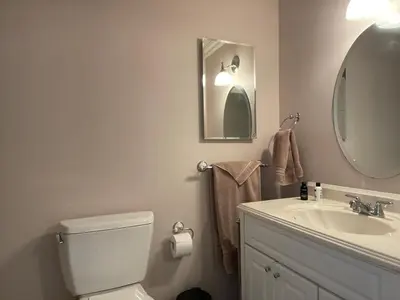 a bathroom with a sink and a toilet and a mirror at Wondrous Stays in Temecula