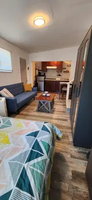 a living room with a couch and a table at New ! Lovely Studio w/ patio, Parking on premises in Escondido