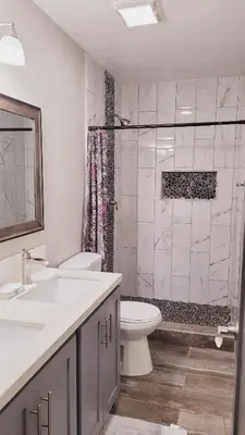 a white bathroom with a toilet and a shower at New ! Lovely Studio w/ patio, Parking on premises in Escondido