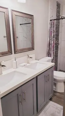 a bathroom with two sinks and a toilet at New ! Lovely Studio w/ patio, Parking on premises in Escondido