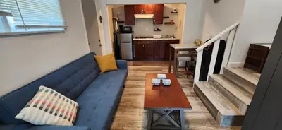 a living room with a blue couch and a table at New ! Lovely Studio w/ patio, Parking on premises in Escondido