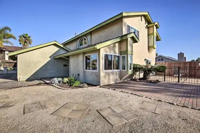 a house with two metal plates in front of it at Breeze By the Pool Chula Vista Home with Game Room in Chula Vista