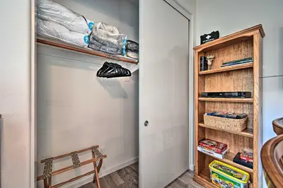 a hallway with a closet with shoes on the door at Chula Vista Studio with Hot Tub about 9 Mi to Downtown in Chula Vista