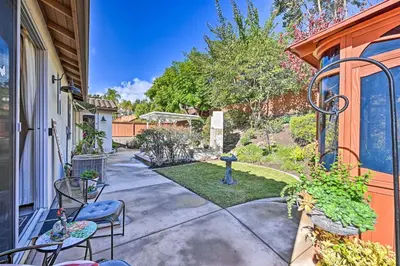 a patio with chairs and a bird feeder on a house at Chula Vista Studio with Hot Tub about 9 Mi to Downtown in Chula Vista