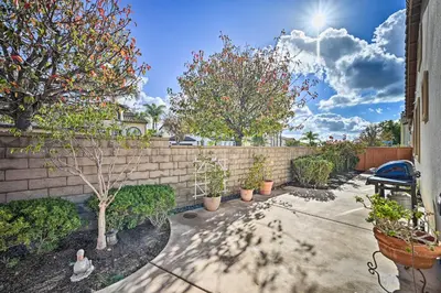 a backyard with plants and a brick wall at Chula Vista Studio with Hot Tub about 9 Mi to Downtown in Chula Vista