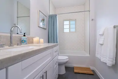 a bathroom with a sink and a toilet and a shower at Fabulous New 4BR/3BA House in Mission Hills in San Diego