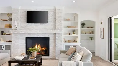 a living room with a fireplace with a tv at Pinot Point by AvantStay Massive Estate 10 mins from Temecula Wineries in Temecula