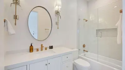 a white bathroom with a sink and a mirror at Pinot Point by AvantStay Massive Estate 10 mins from Temecula Wineries in Temecula