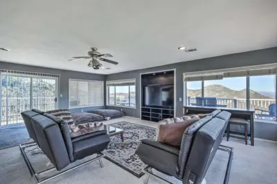 a living room with a couch and chairs and a television at Escondido Hilltop Home with Deck and Views! in Escondido
