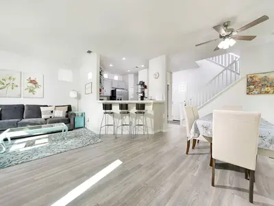 a living room with a couch and a table at King-30min to Airport-Self Check In-Parking-367Mbps in Rancho Santa Margarita