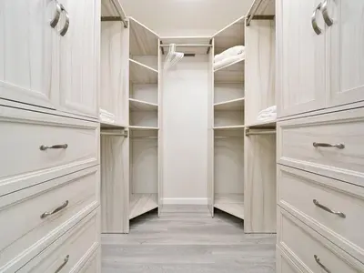a walk in closet with white cabinets and shelves at King-30min to Airport-Self Check In-Parking-367Mbps in Rancho Santa Margarita