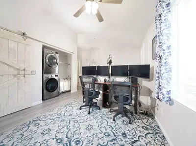 a home office with a desk and a washing machine at King-30min to Airport-Self Check In-Parking-367Mbps in Rancho Santa Margarita