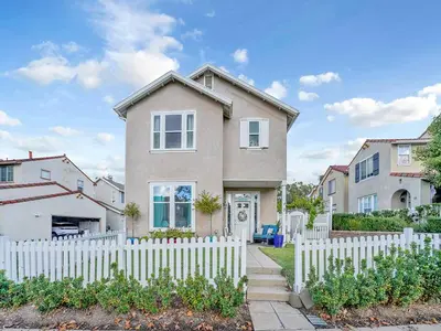 a house with a white picket fence at King-30min to Airport-Self Check In-Parking-367Mbps in Rancho Santa Margarita