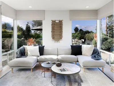 a living room with a couch and a table at Grandview Getaway, Luxury 4BR, Ocean View, Fire Pit in Encinitas