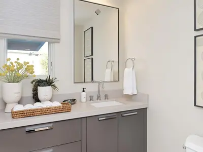 a bathroom with a sink and a mirror at Grandview Getaway, Luxury 4BR, Ocean View, Fire Pit in Encinitas