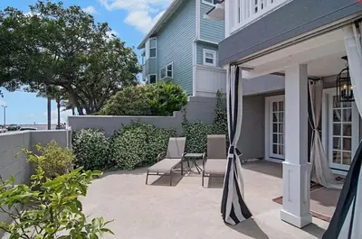 a patio with two chairs and a gazebo at Remodeled Beach Bungalow, Block to the Beach in Carlsbad