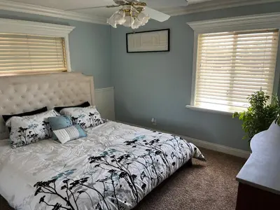 a bedroom with a bed and a ceiling fan at Peaceful & Cozy 3 bedroom Ranch-Home w/Fireplace in Hemet