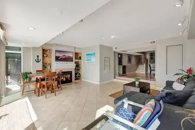 a living room with a couch and a table at OCEAN FRONT - STUNNING VIEWS- VACATION PARADISE!! in Dana Point