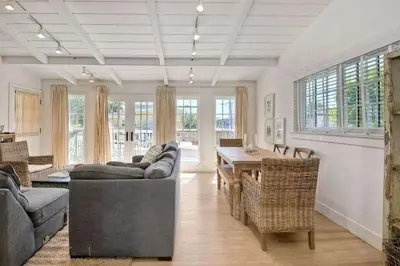 a living room with couches and a table and chairs at Walk to Beach, Patio with Ocean View, AC in Carlsbad