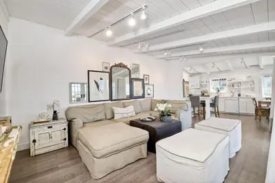 a living room with a couch and a table at Ocean Views, Across The Street From Beach, Private Patio in Carlsbad
