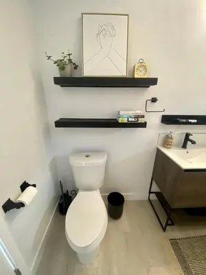 a bathroom with a white toilet and a sink at Village District! Cleo Beach! 5 Min Walk to DTWN! in Laguna Beach