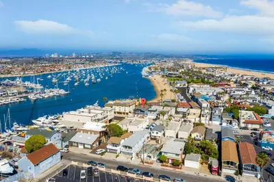 an aerial view of a harbor with boats in the water at Walk on the Ocean! Wake up to Beautiful Bay Views in Newport Beach