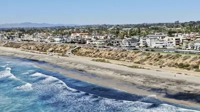 an aerial view of a beach with houses and condos at Ocean View From Private Patio, Across Street From Beach in Carlsbad