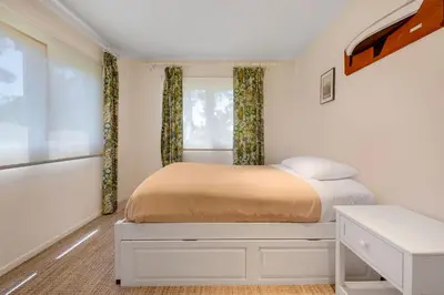a bedroom with a bed and a window at Tattenham 1705 in Encinitas