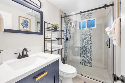 a bathroom with a sink and a shower at Tower 9 #1 in Oceanside