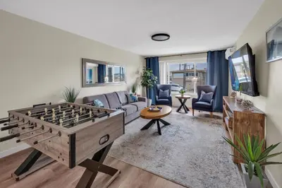 a living room with a large foosball table at Tower 9 #4 in Oceanside