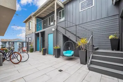 a building with bikes parked on a patio at Tower 9 #4 in Oceanside