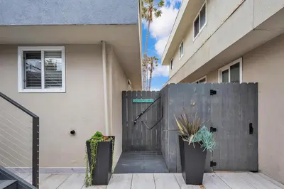a wooden entrance to a building with a wooden gate at Tower 9 #5 in Oceanside
