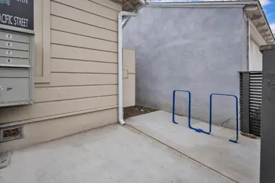 a garage door with blue handles in front of a building at Tower 9 #5 in Oceanside