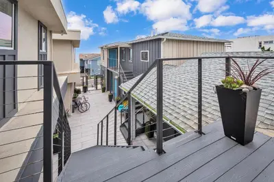 a balcony of a house with a stair case at Tower 9 #5 in Oceanside