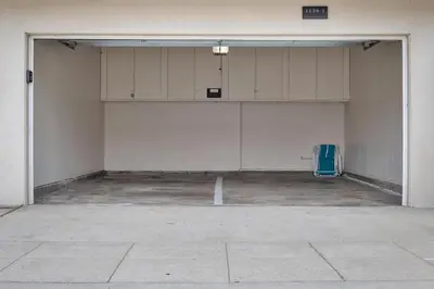 a large room with white cabinets in a garage at Tower 9 #5 in Oceanside
